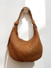 The Maymith Store handcrafted tan woven leather hobo bag with a braided shoulder strap and vintage washed finish.